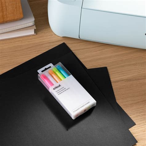 2009849 - Cricut 5 medium point (1.0 mm) opaque pens in pink, white, orange, yellow, and blue; Highly opaque ink shows up well on light and dark materials; Embellish projects with personal notes or drawings using your Cricut® cutting machine; Ideal for paper crafts, cards, labels, invitations, or adding a "handwritten" message; For Cricut Maker® and Cricut Explore® machines; Water-based, acid-free, nontoxic, permanent after dry; conforms to ASTM D-4236